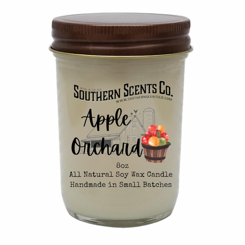 Glass candle jar with brown lid labeled 'Southern Scents Co. Apple Orchard' on a white background