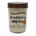 Glass candle jar with brown lid and 'Southern Scents Co.' label on a white background